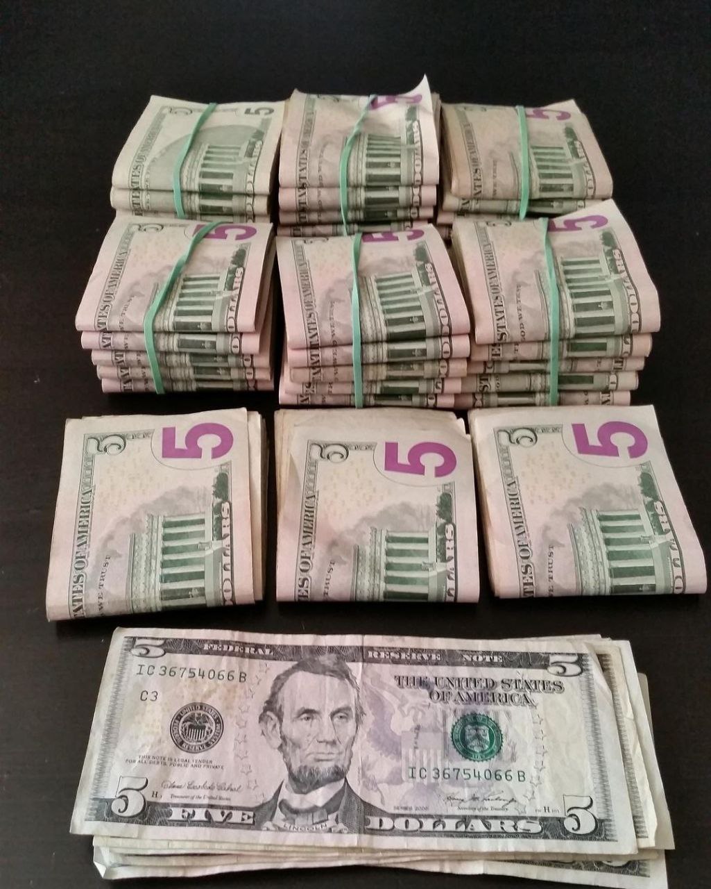 stacks of fake 5 dollars bills for sale