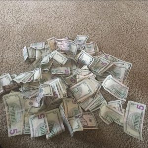 stacks of fake $5 bills for sale